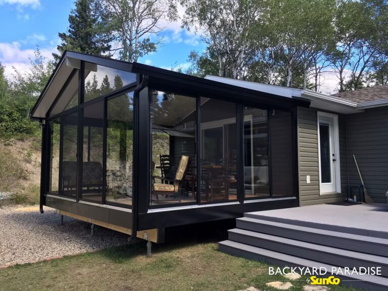 Modern black gable sunroom with outdoor seating installed in Ditch Lake, Manitoba
