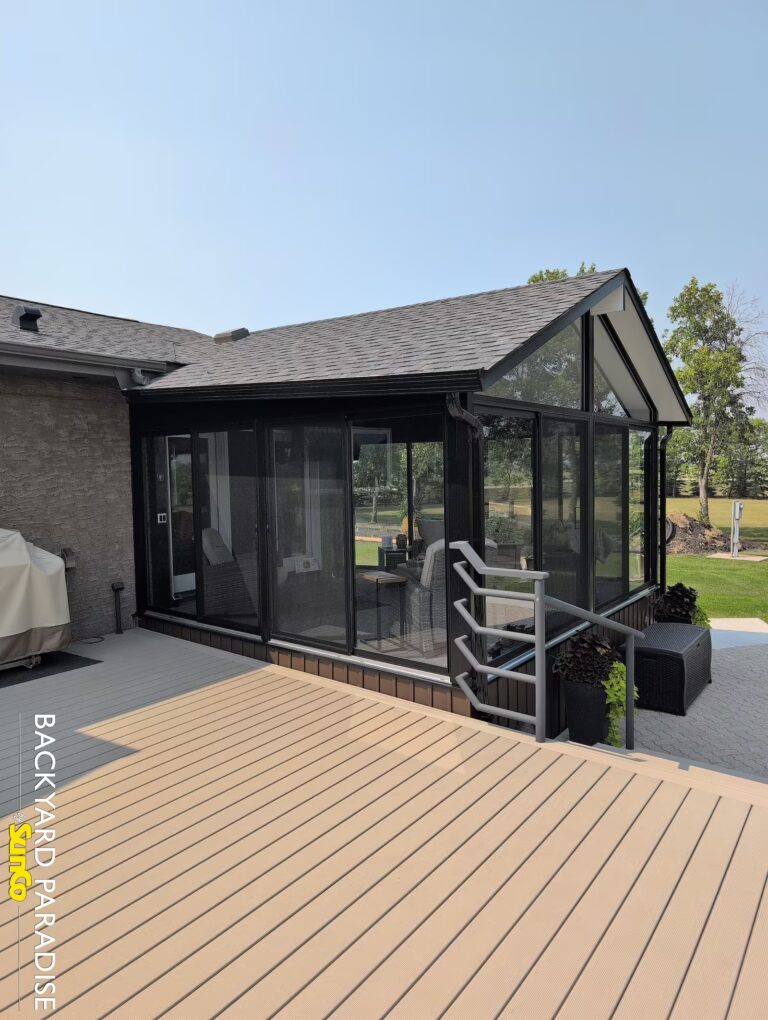 Black gable sunroom with angled side walls installed in St. Andrews, Manitoba.