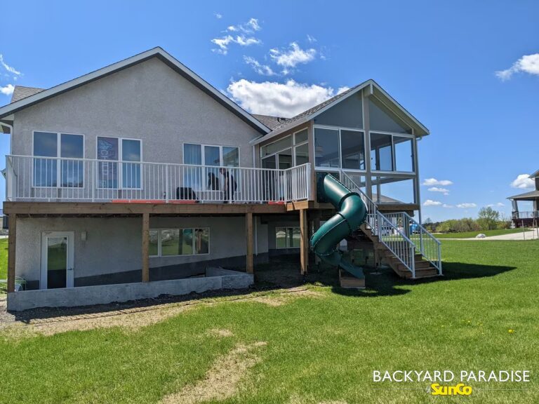 Elevated gable sunroom over walk out basement installed in Headingley, Manitoba.