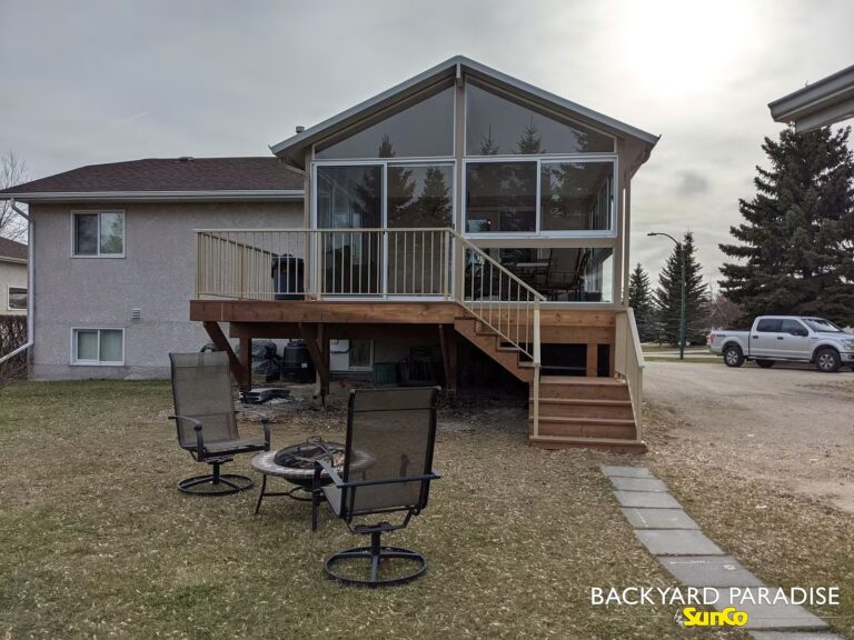 Sandalwood and white gable sunroom with wrap-around deck installed in Stonewall, Manitoba.